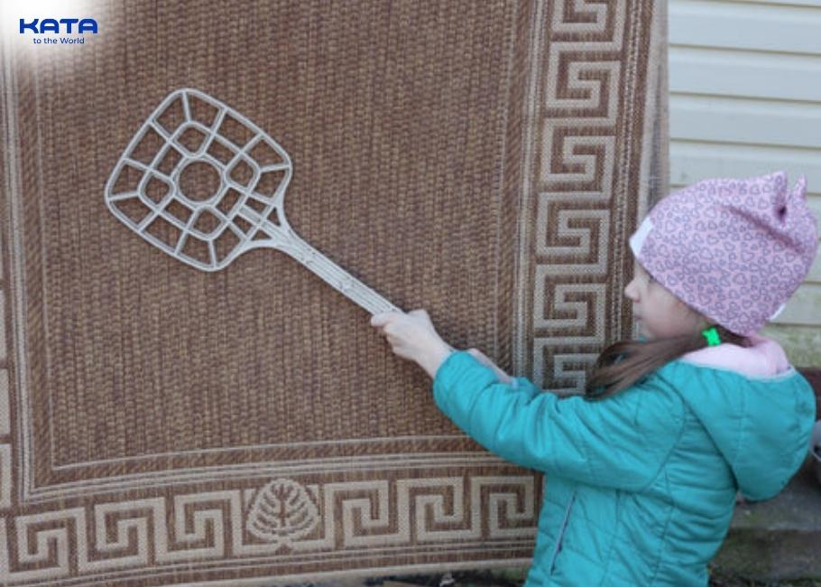 use a carpet beater to clean carpets