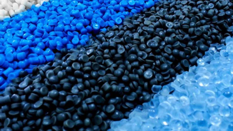 Raw PVC resin pellets used for manufacturing premium car floor mats.